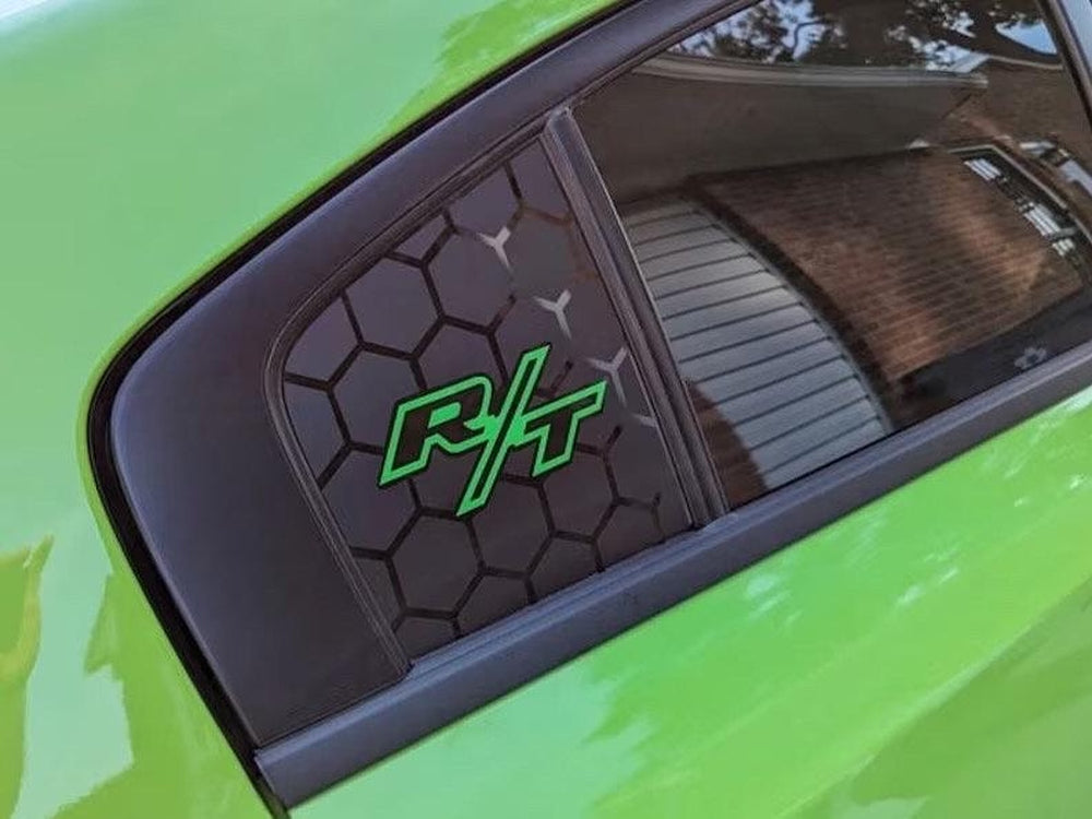 Dodge Charger quarter window with black honeycomb pattern decal featuring bright green R/T logo, showcasing custom styling on vibrant green vehicle exterior