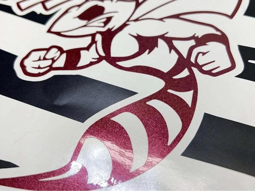 Close-up view of a metallic red Angry Hornet logo decal for Dodge Challenger quarter windows, showcasing detailed design and premium vinyl quality against a black and white background