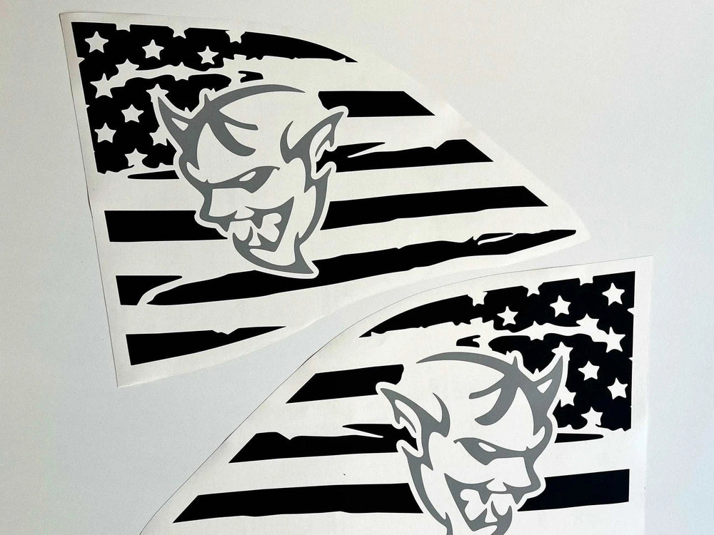 Challenger quarter window decals featuring Demon logo design with American flag background, displayed as two matching triangular stickers in black and white, showcasing custom vinyl graphics for Dodge Challenger.