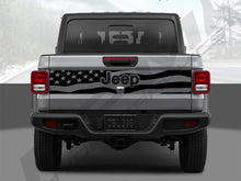 Load image into Gallery viewer, Rear view of a silver 2020+ Jeep Gladiator with a black American flag decal spanning the tailgate, showcasing patriotic customization for the vehicle&#39;s exterior design
