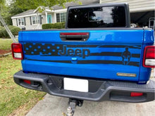 Load image into Gallery viewer, Blue Jeep Gladiator tailgate with custom American flag decal featuring Jeep logo and Spartan helmet design, parked in front of a suburban house with green lawn