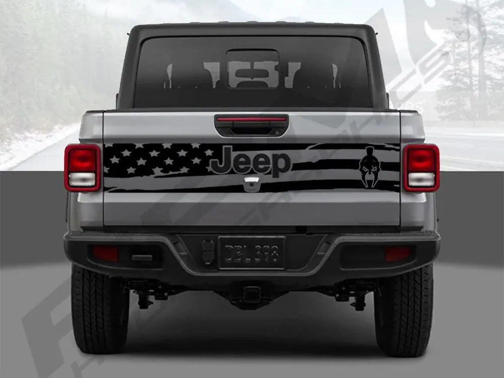 Rear view of a silver Jeep Gladiator truck with a tailgate decal featuring a black and white American flag design and Jeep logo, showcasing the custom vinyl decal product for 2020+ models.