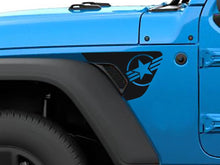 Load image into Gallery viewer, Blue Jeep Wrangler fender with custom black vinyl decal featuring star and stripes logo, showcasing precise fitment and patriotic design on vehicle&#39;s exterior