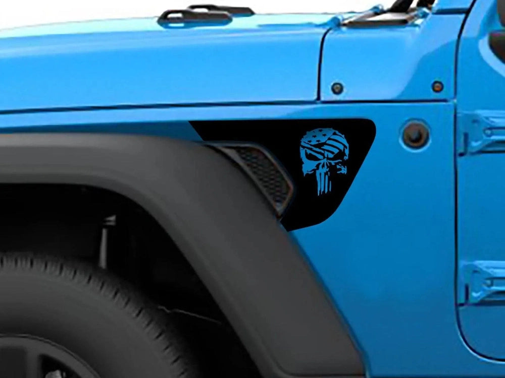 Blue Jeep Wrangler fender with black Punisher skull flag logo decal installed, showcasing custom vinyl application for Gladiator and Wrangler models