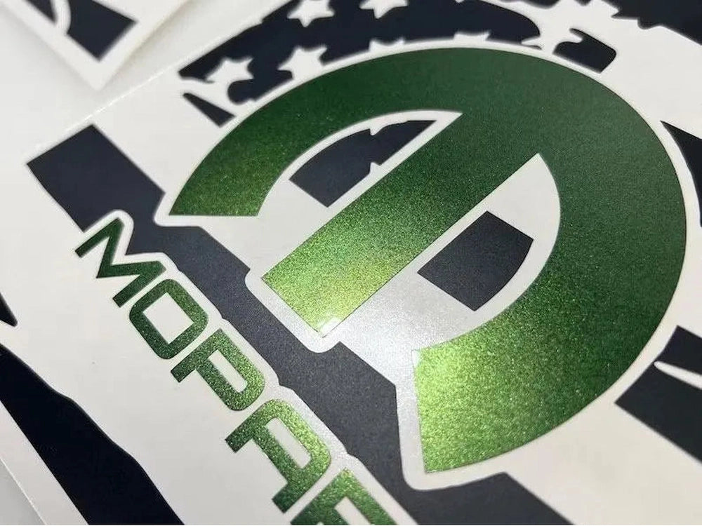 Close-up of green MOPAR logo decal for Dodge Charger quarter window, featuring gradient metallic finish and sleek design on white background, showcasing premium vinyl quality for 2011-2023 models