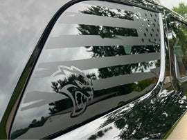 Dodge Durango quarter window decal featuring American flag design with Hellcat logo, showcasing custom vinyl application on vehicle's side window for personalized automotive styling