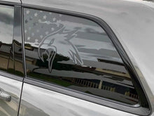 Load image into Gallery viewer, Jeep Grand Cherokee quarter window with custom Trackhawk head logo decal and American flag design, showcasing patriotic styling on a silver vehicle exterior